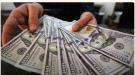 الدولار ينخفض إلى ما دون أعلى مستوى له في ثلاثة أسابيع.